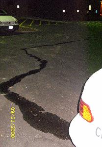 long trail of desperate woman's pee going across a car park